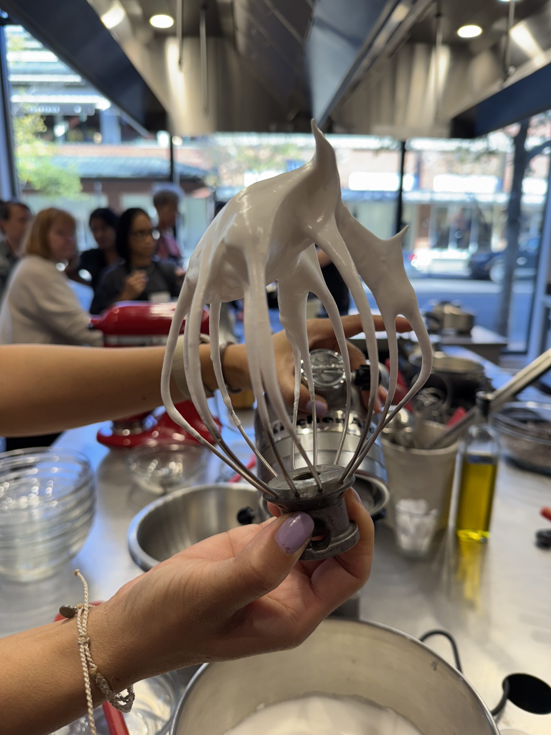 testing the peaks of the butter cream filling at sur la table macaron class