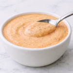 a bowl of A creamy, peppery Raising Cane’s sauce copycat made with simple pantry ingredients.