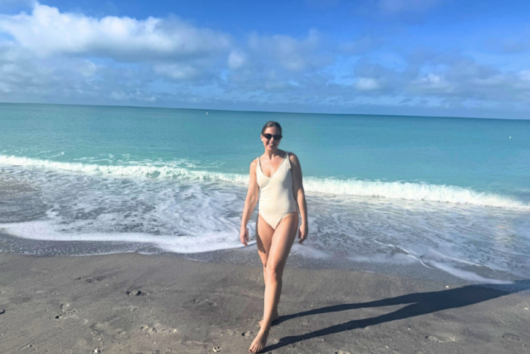 woman in white one piece on englewood beach