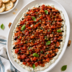 Boursin bruschetta dip with tomato bruschetta, balsamic glaze, fresh basil, and garlic naan crackers.