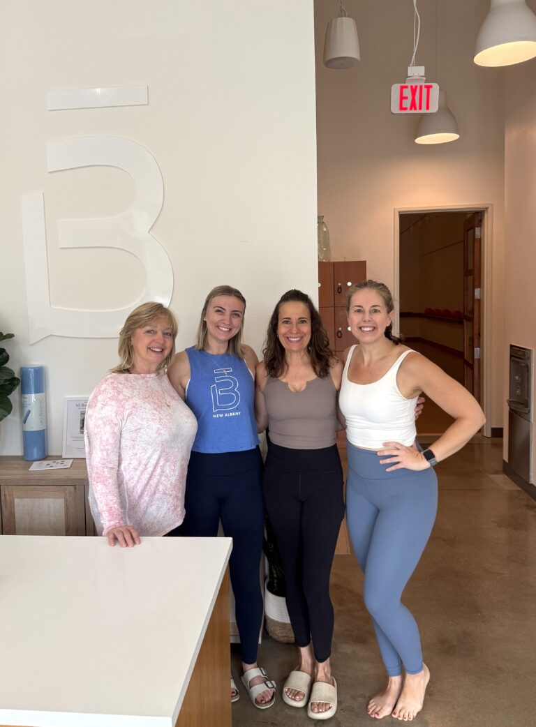 Four women smiling together after a Barre3 class, illustrating how fitness studios can become social third spaces and communities.