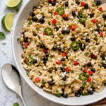Mexican street corn pasta salad with charred corn, black beans, red bell pepper, jalapeño, cilantro, cotija cheese, and creamy chili-lime dressing.