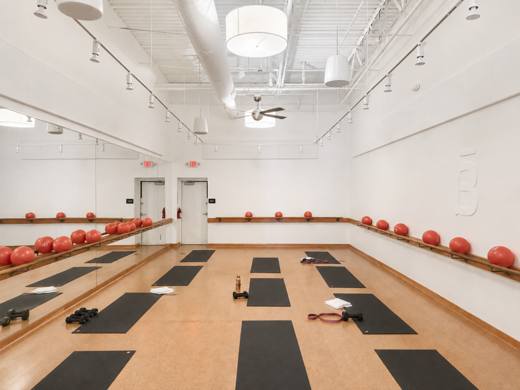 a barre3 studio filled with mats and props after a 45-minute strength class